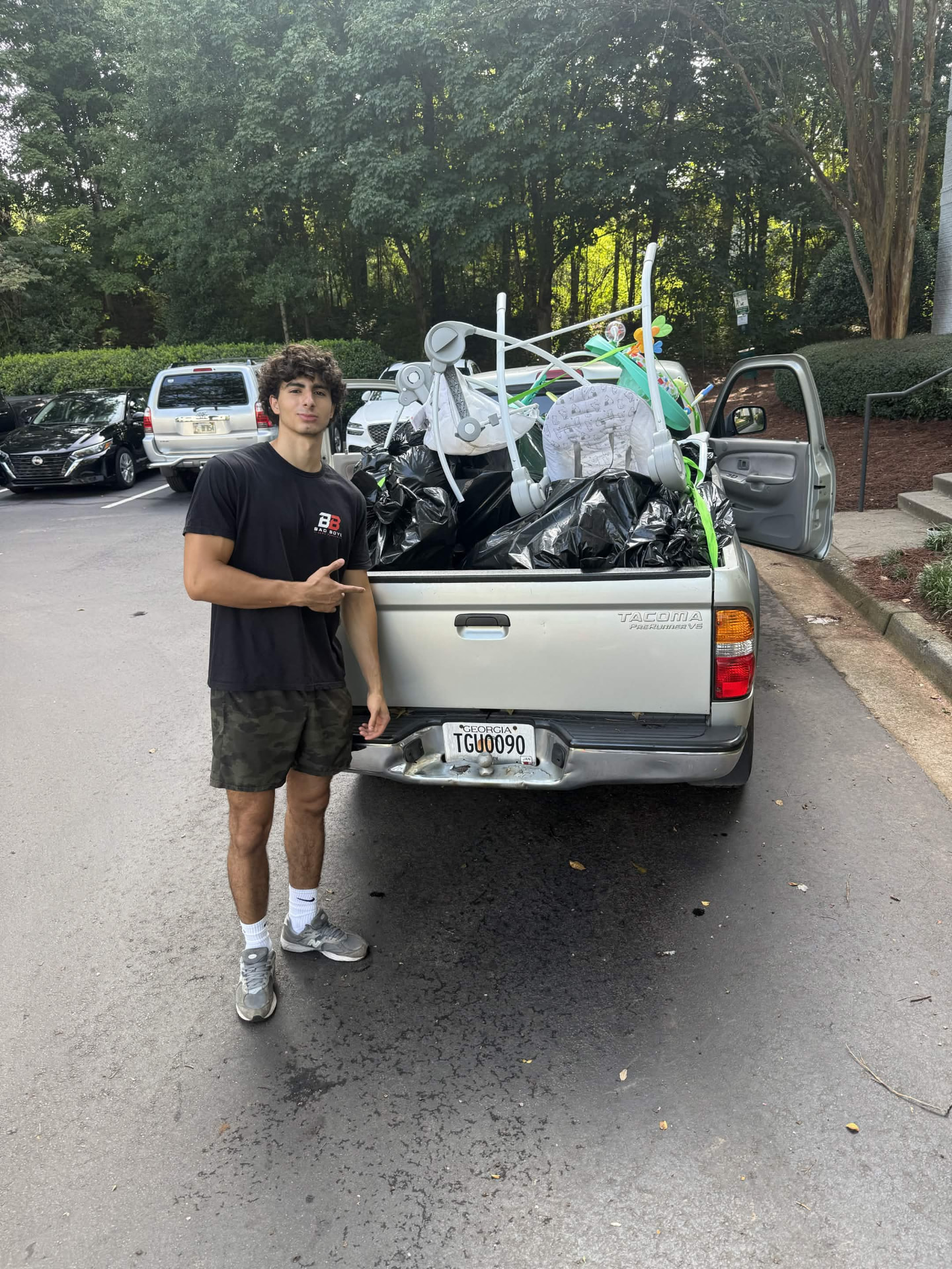 Bad Boys Junk Removal truck with a full truckload of junk from a cleanout job
