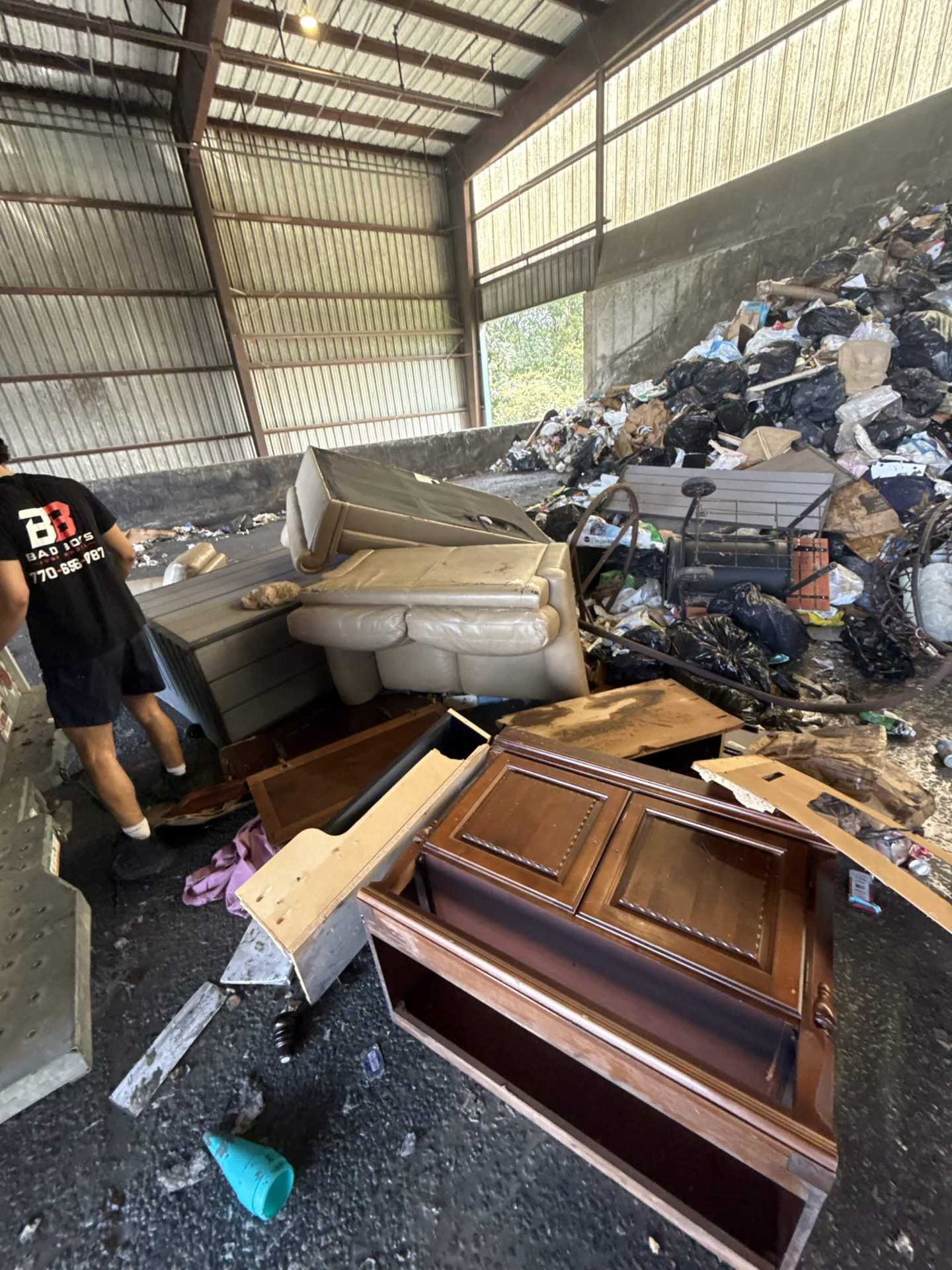 Sofa, dresser, cabinets and furniture junk unloaded at the disposal facility after a North Atlanta cleanout